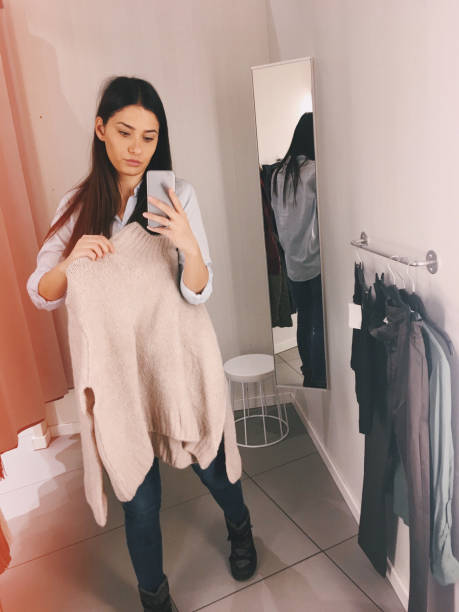 istock Young woman in a fitting room 877069188