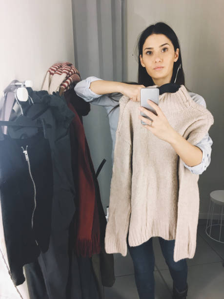 istock Trying out clothes in a fitting room 877069194