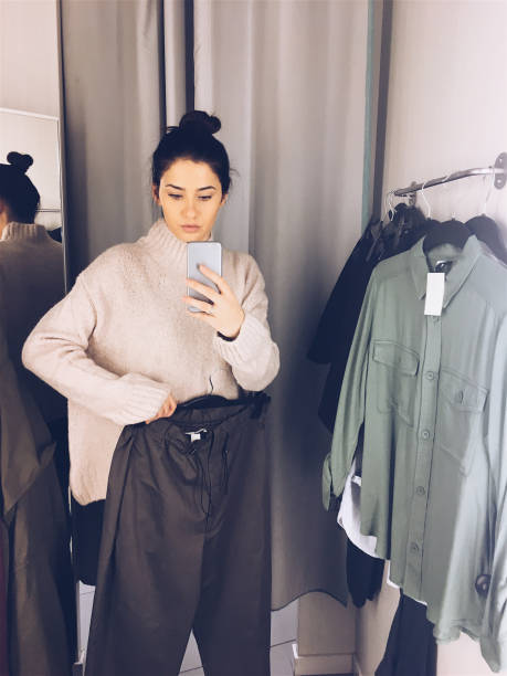 Photographing in a fitting room while trying clothes