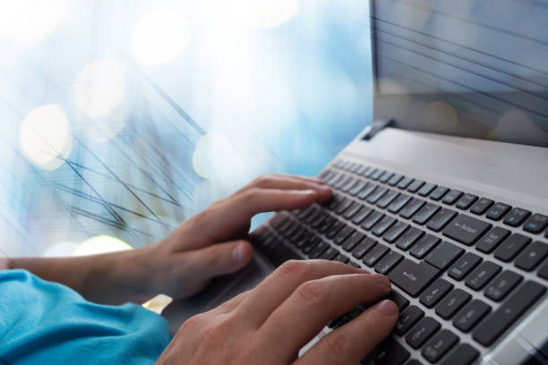 istock Man's hands typing on laptop notebook keyboard in the office. Man browsing information on internet. Freelance blogging, it support concept 877072438