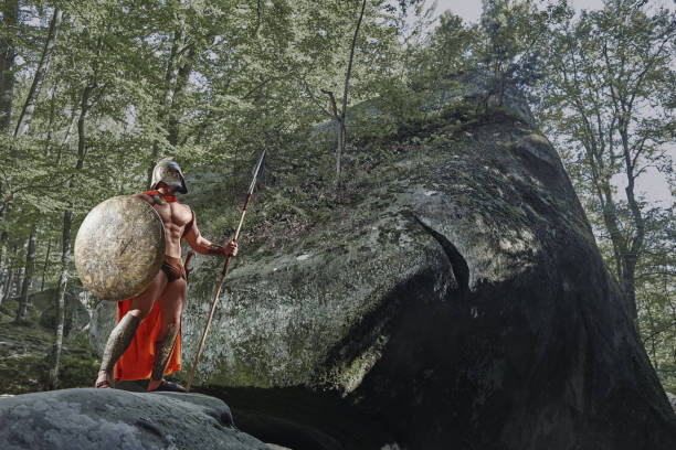 istock Spartan warrior in the woods 877075380