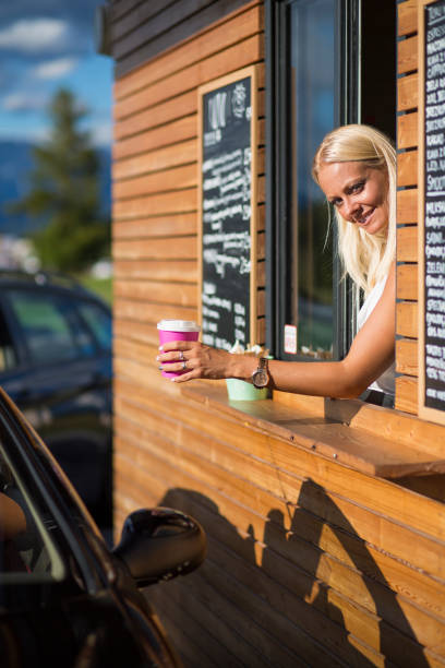 istock Drive-in caffe female clerk 877076924