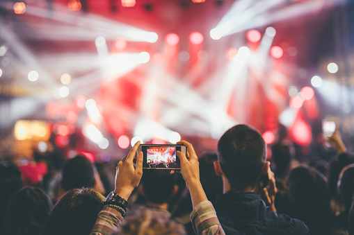 Taking photo at a music concert