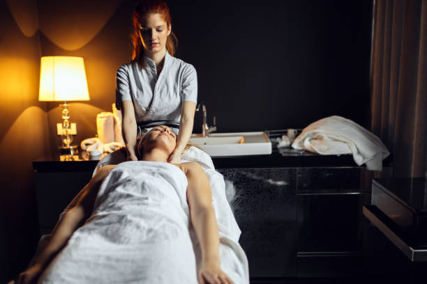 istock Beautiful woman enjoying massage treatment 877079076