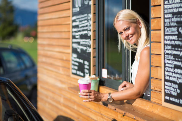 istock Drive-in caffe female clerk 877079156