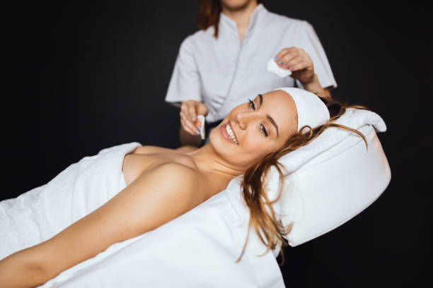 istock Lovely brunette enjoying massage 877079284