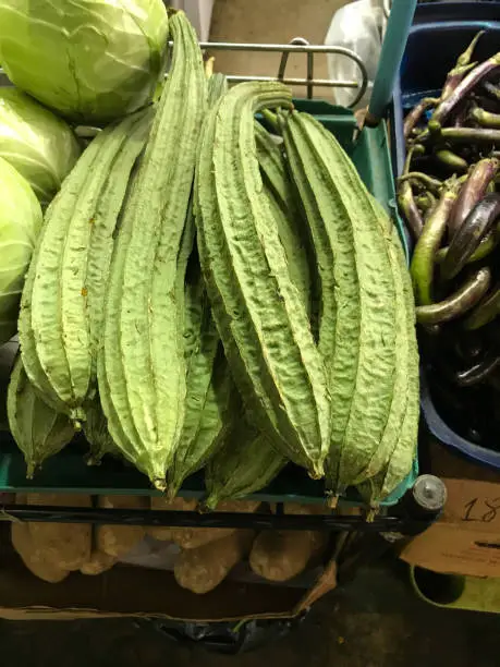 A bin of bittermelon for sale at a Hawaii farmer’s market