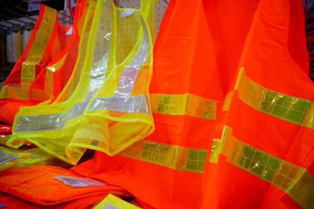 istock orange reflective vest as part of protection uniform 877080242