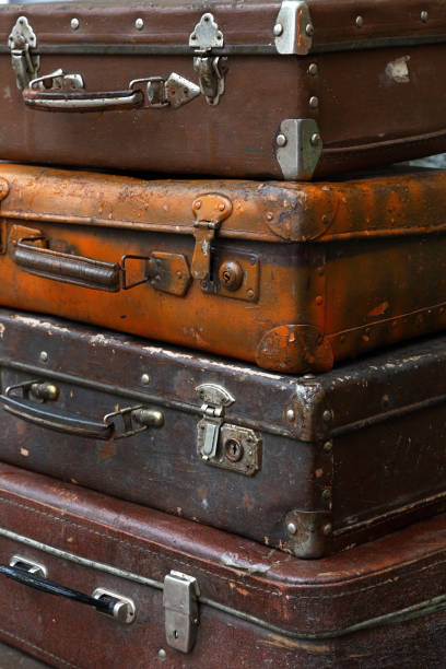 istock Stack of old vintage travel suitcases close up 877082992