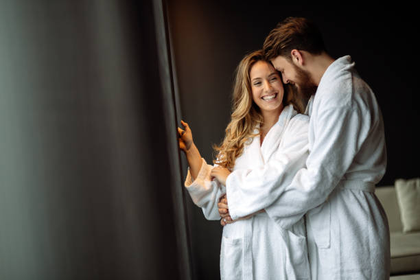 Couple enjoying wellness weekend Couple enjoying wellness weekend and spa bathrobe stock pictures, royalty-free photos & images