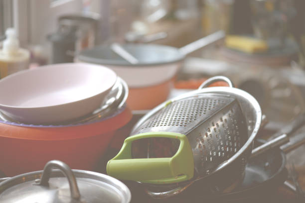 istock dirty dishes in the sink 877088066