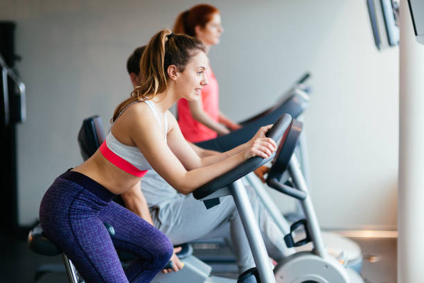istock People traning in gym on various machines 877096436