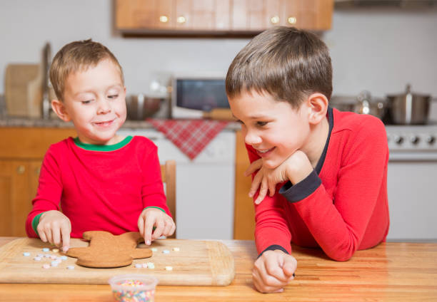 istock children decorate gingerbread man 877101744