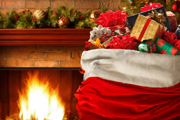 istock Santa's Bag In Front Of Fireplace 877102392