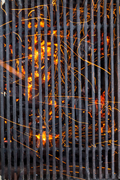 istock Barbecue Fire Grill Isolated On The Black Background, Close-up 877102488