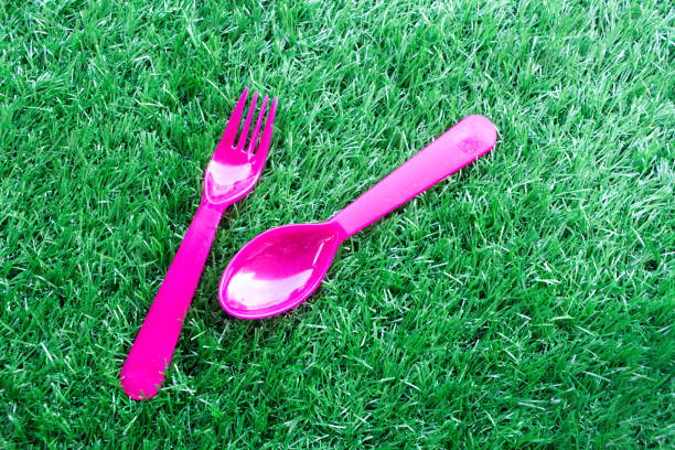istock The pink color of plastic spoon and fork 877102652