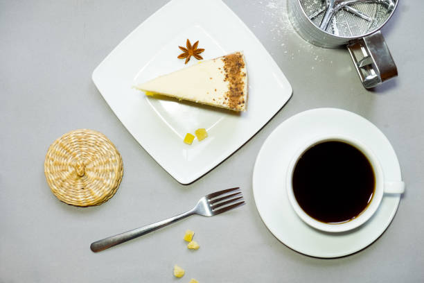 istock Coffee cup and a plate with cookies on a background 877105960