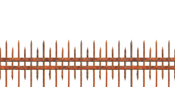 Old rusty forged fence isolated on white background. Metal paling in the form of a peak, a medieval fence, a panorama Old rusty forged fence isolated on white background. Metal paling in the form of a peak, a medieval fence, a panorama metal stud stock pictures, royalty-free photos & images