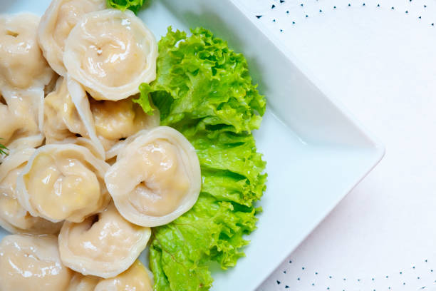 istock Close up dumplings, pierogi before boiling vegetarian food 877106828
