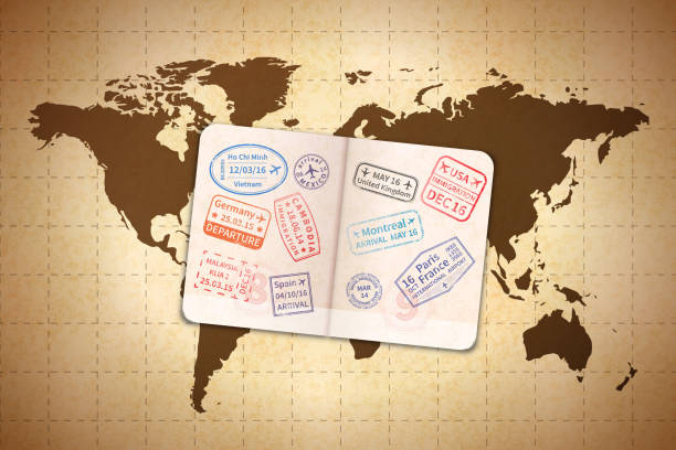 istock Open foreign passport with international visa stamps on ancient world map on old textured paper 877109772