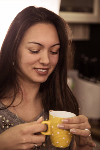 istock Enjoying in cup of coffee. 877109952