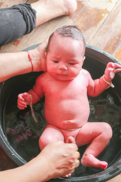 istock newborn child boy having his bath 877111980