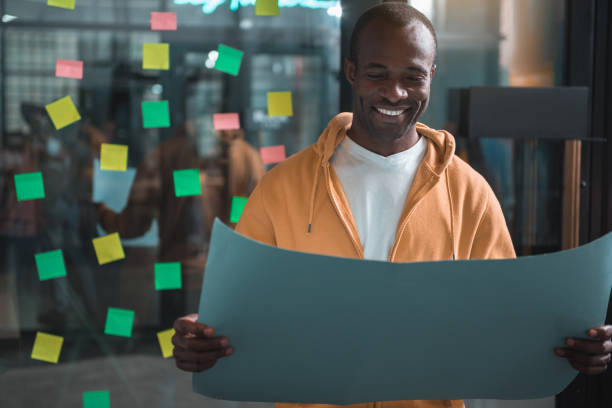 istock Confident positive young employee is expressing gladness 877115128