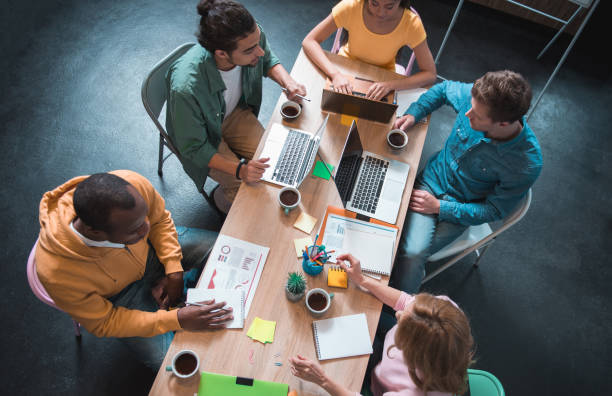 istock Cheerful colleagues having job in office 877119018