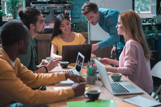 istock Cheerful business team having job together 877121644