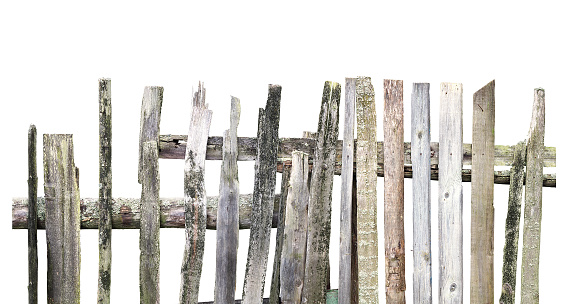 Panorama of old wooden fence of different boards isolated on white background. Broken fence