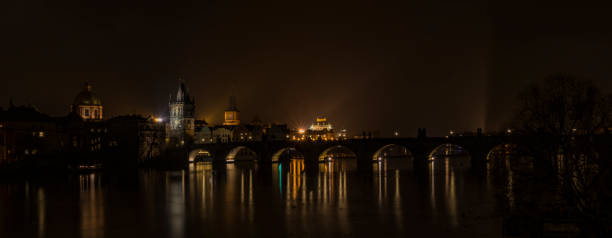istock View for Charles bridge in night Prague 877129574