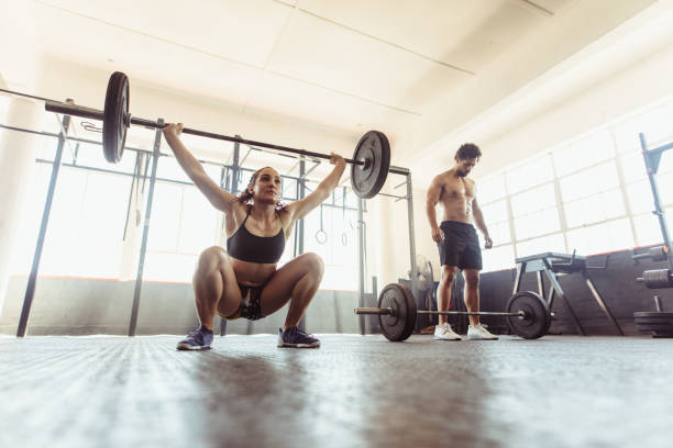 istock Woman performing deadlift exercise 877129610