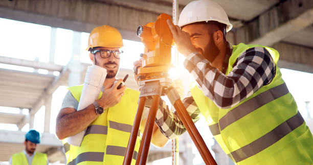 istock Team of architects people in group on construciton site 877130182