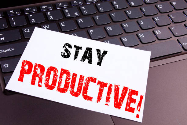 istock Writing Stay Productive text made in office close-up on laptop computer keyboard. Business concept for Concentration Efficiency Productivity Workshop on the black background with copy space 877133214