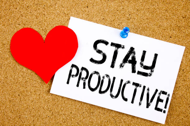 istock Conceptual hand writing text caption inspiration showing Stay Productive concept for Concentration Efficiency Productivity and Love written on sticky note reminder cork background copy space 877133432