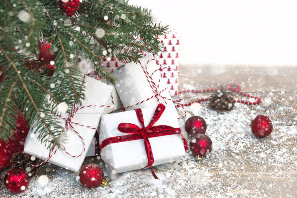istock Christmas holiday background. Gifts under christmas tree. Copy space. Effect drawn snow. 877135856