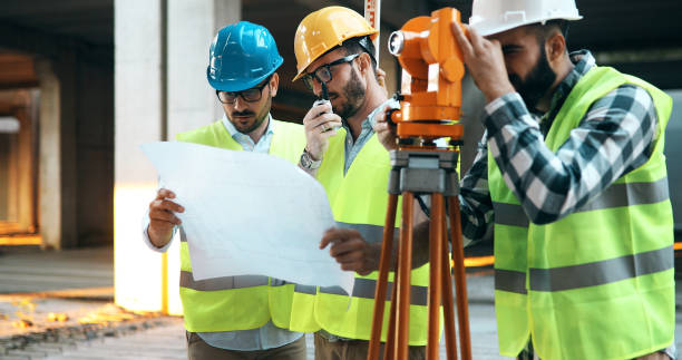 istock Team of architects people in group on construciton site 877136100