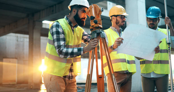 istock Team of architects people in group on construciton site 877136400