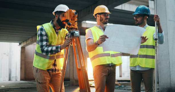 istock Team of architects people in group on construciton site 877136636