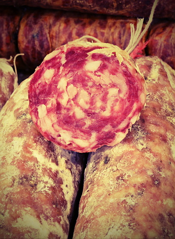 genuine salami for sale in a stand of the Tuscany region in Italy with vitange effect