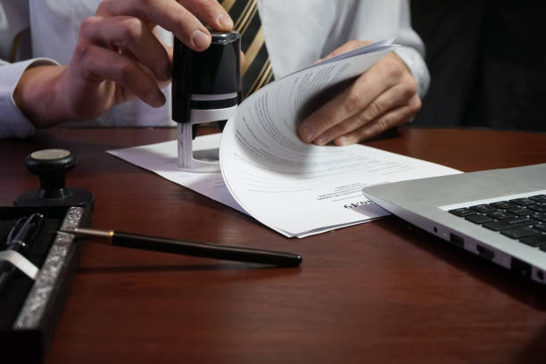 istock The businessman puts a stamp on the contract 877140526
