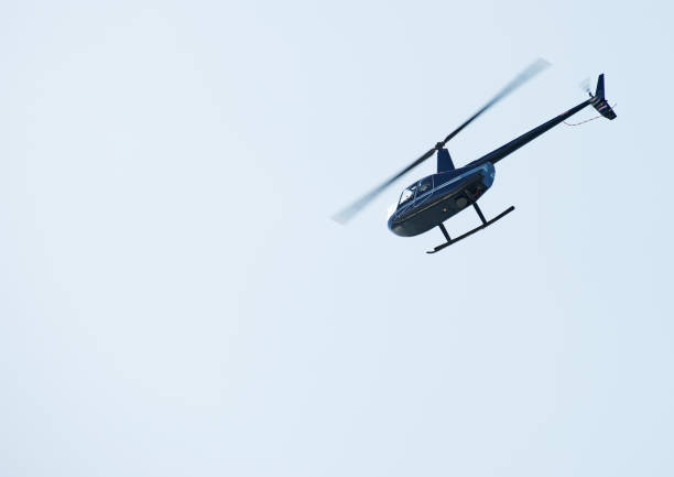 istock Small private helicopter in the sky. 877144426
