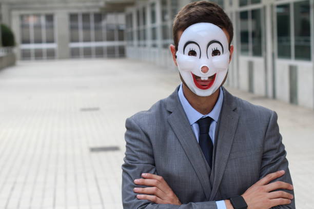 Scary businessman wearing a mask.