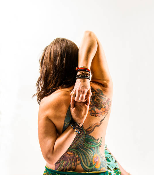 istock Middle-aged woman in her 40's practising yoga 877149050