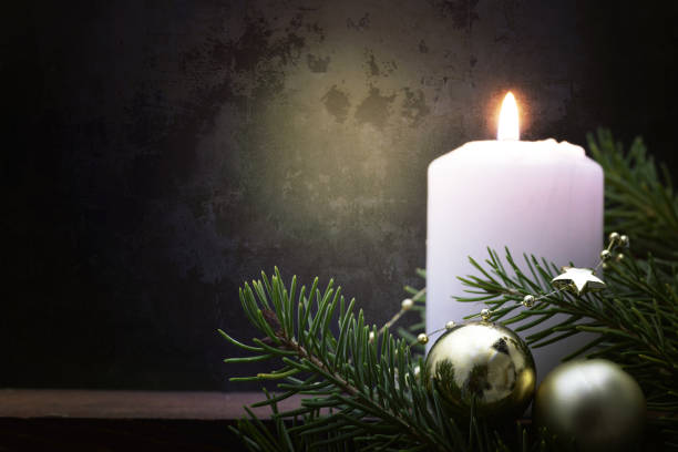 istock Christmas candle on dark grunge background 877153518