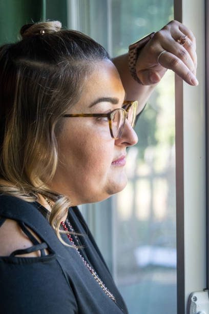 istock Pensive woman looking away 877156818