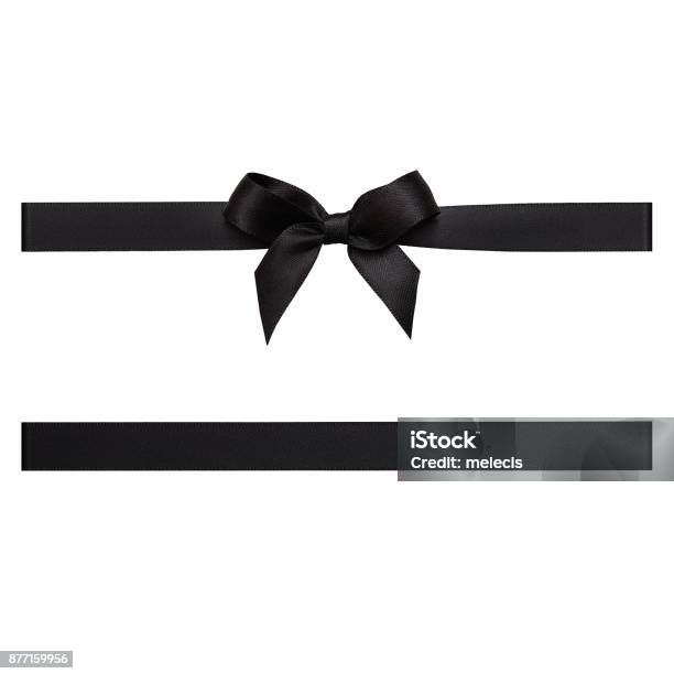 Black Color Gift Ribbon Tied In A Bow On White Background Cut Out Stock Photo - Download Image Now