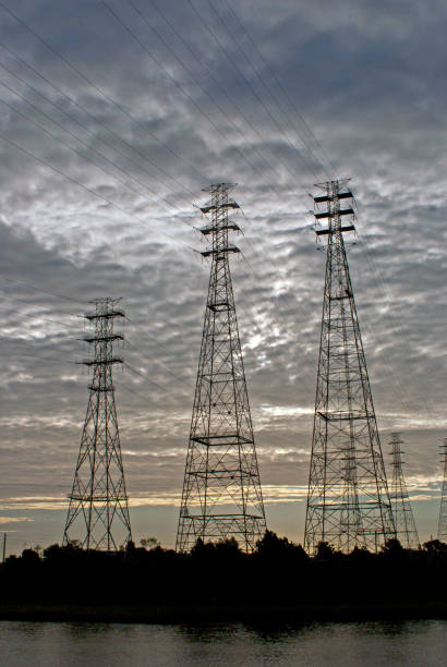 istock Electrical Towers At Dusk With Broken Gray Skies 877163802