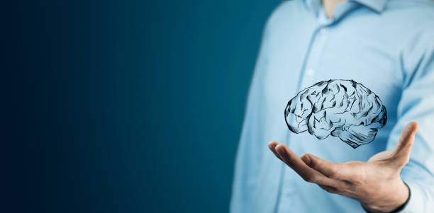 istock businessman hand holding brain in palm 877167724