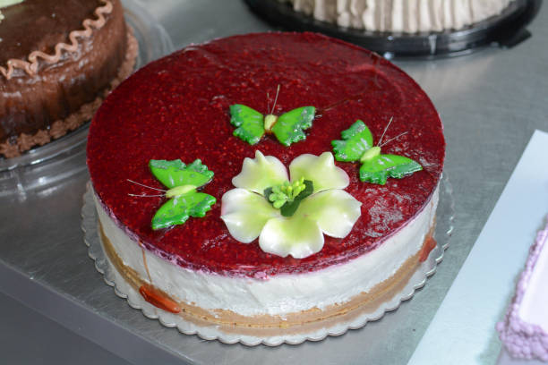 istock Cheese cake whit green butterfly 877174392